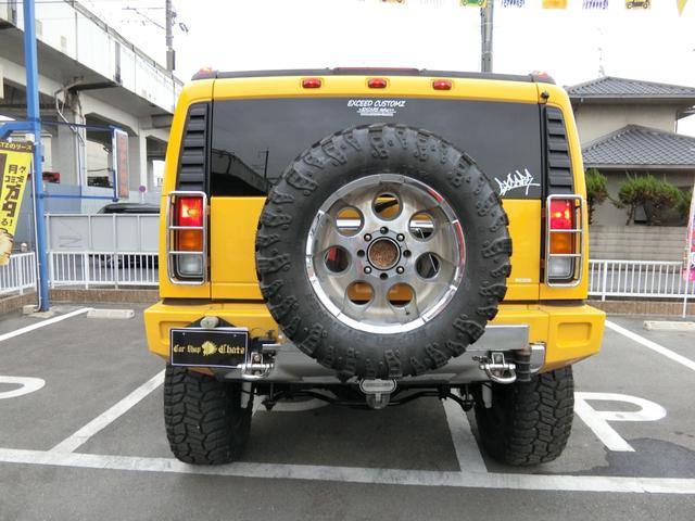 ベースグレード 左H 4WD 外20AW リフトアップ 外マフラー 背面タイヤ HID 大型4連フォグ 後席モニター サンルーフ 黒本革 PWシート シートH HDDナビ フルセグTV バックカメラ メッキパーツ(8枚目)