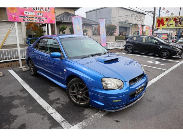 ＷＲＸ　２００３　Ｖリミテッド　５ＭＴ　ターボ　４ＷＤ　ＳＴＩエアロ　レイズ１７ＡＷ　ローダウン　ＨＩＤ　リアスポ　タワーバー　セミバケシート　モモステ　メモリーナビ　フルセグ　ＤＶＤ再生　キーレス　ＥＴＣ　オートＡＣ　Ｔタイベル済(3枚目)