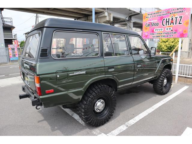 ランドクルーザー６０ ＶＸ　グリーン／クロ全塗装　ディーゼルターボ　切替４ＷＤ　外品グリル　外品バンパー　Ｒヒッチメンバー　外品１６インチＡＷ　リフトアップ　革調シートカバー　外品ディスプレイオーディオ　ＥＴＣ　外品ステアリング（7枚目）