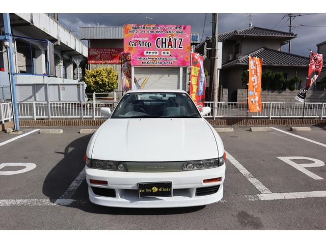 180SX タイプX シルエイティ仕様(Fバンパーフェンダー・ボンネット・ヘッドライト) 5MT ターボ S・Rエアロ Rウイング SSRアルミ 車高調 HKSマフラー MOMOステ BRIDEセミバケ Bluetooth(2枚目)
