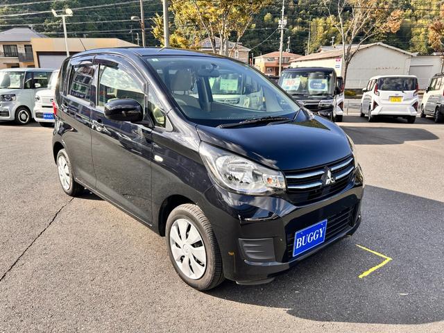 eKワゴン E 1年保証 走行52787Km CDチューナー 電動格納式ドアミラー 社外アルミホイール ベンチシート 衝突安全ボディ ABS キーレスエントリー(7枚目)