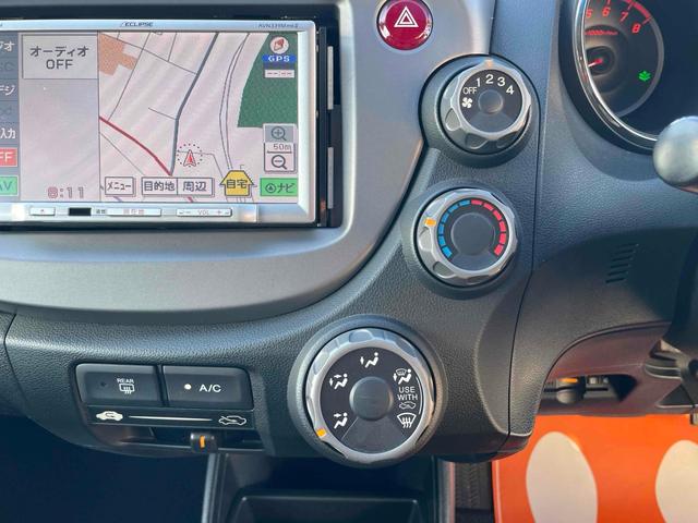 フィット G・10thアニバーサリー ETC ナビ TV オートライト スマートキー 電動格納ミラー チップアップシート CVT 盗難防止システム 衝突安全ボディ ABS CD エアコン パワーステアリング パワーウィンドウ(4枚目)