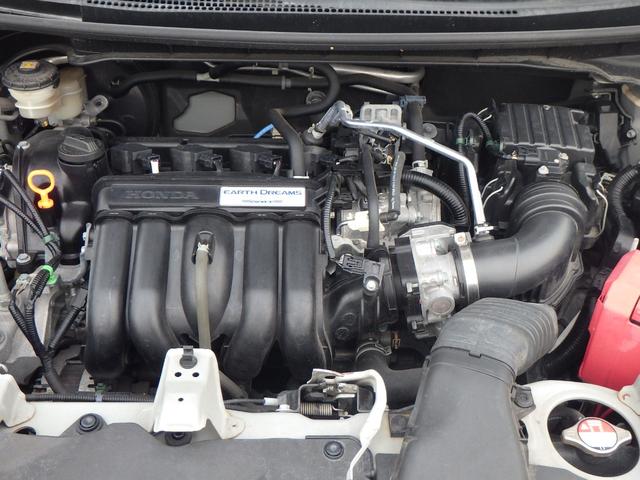 フィット 13G・Fパッケージ DVD再生可能 スマ-トキ- 記録簿有り VSA ETC付き 助手席エアバッグ Rカメラ オートエアコン エアバック PS キ-フリ- 1セグ PW ABS アイドリングSTOP(3枚目)