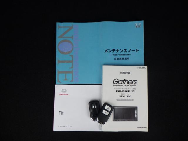 フィット 13G・Fパッケージ DVD再生可能 スマ-トキ- 記録簿有り VSA ETC付き 助手席エアバッグ Rカメラ オートエアコン エアバック PS キ-フリ- 1セグ PW ABS アイドリングSTOP(18枚目)