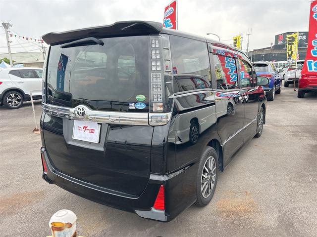 ヴォクシー ZS 煌 ETC バックカメラ ナビ TV 両側電動スライドドア オートライト LEDヘッドランプ スマートキー アイドリングストップ 電動格納ミラー 後席モニター 3列シート CVT アルミホイール CD(14枚目)