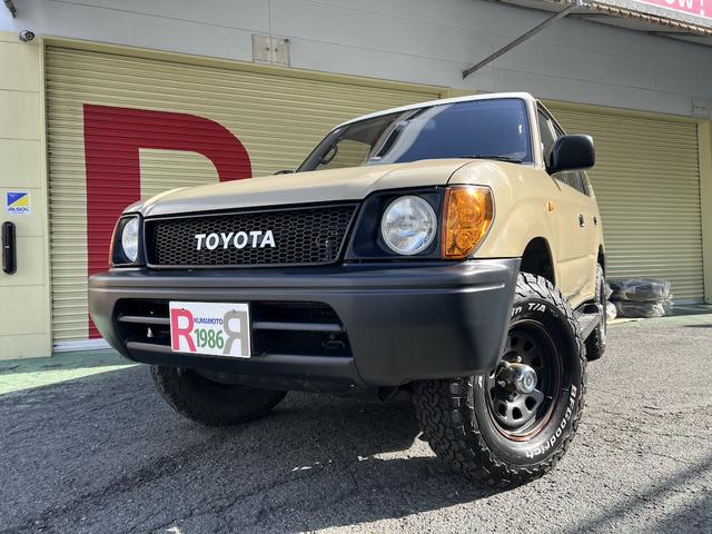 ランドクルーザープラド TX 3.0ディーゼルTB・8人乗・ナロボディー・フルタイム4WD・全塗装車・社外ナビ・フルセグ・Bカメラ・ETC・キーレス・リヤヒーター・ウッドコンビH・丸目フェイス・グリル・社外16AW・ホワイトレター(6枚目)