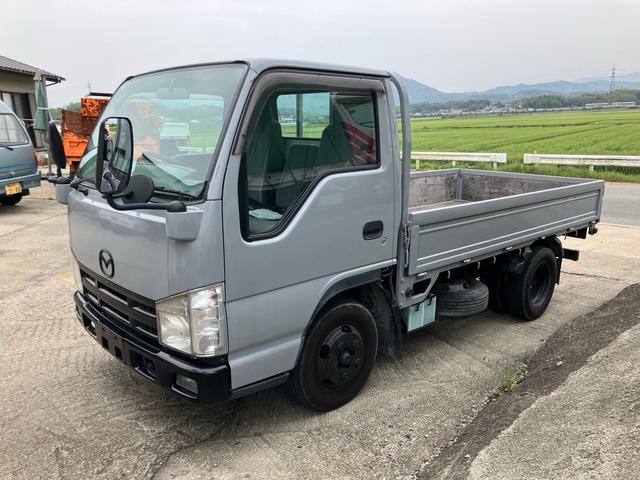 タイタントラック 　平ボディ　１．５ｔ　後Ｗタイヤ　フロアＡＴ　ラジオオーディオ　運転席エアバッグ　エアコン　パワステ　パワーウィンドウ　ＡＢＳ　ターボ　キーレス（2枚目）