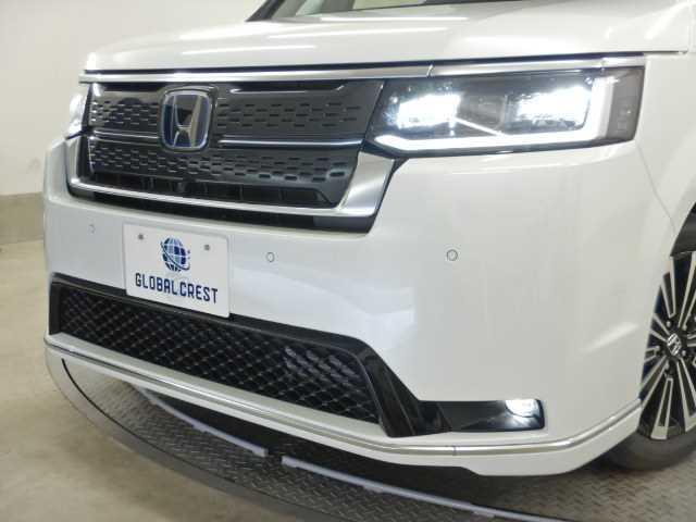 ステップワゴン ２．０ｅ：ＨＥＶ　ＳＰＡＤＡ　ＰＲＥＭＩＵＭ　ＬＩＮＥ　７人　マルチカメラ　両側自動ドア　Ｆセグ　ＵＳＢ接続　クリアランスソナ　クルーズＣ　助手席エアバッグ　電格ミラー　スマートＫ　シ－トヒ－タ－　バックカメラ　オットマン　ＬＥＤライト　キーフリー　３列シート（15枚目）