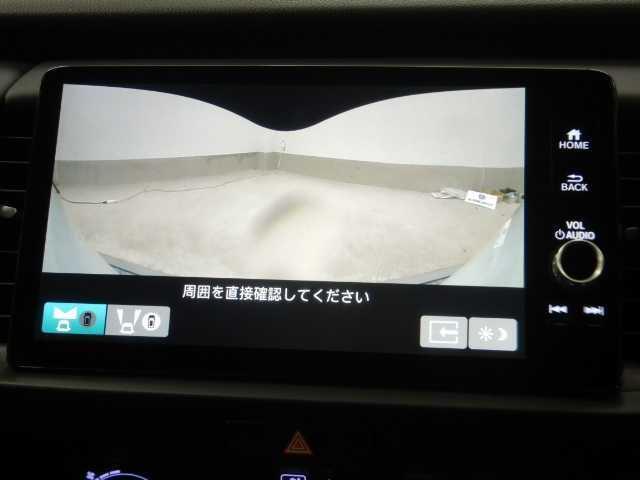 フィット １．５ｅ：ＨＥＶ　ホーム　全方位カメラ　ナビ／ＴＶ　前後誤発進抑制機能　マルチビュー　助手席エアバッグ　運転席エアバッグ　衝突安全ボディ　電格ミラー　ＬＥＤライト　ＵＳＢ接続　バックカメラ　ＡＢＳ　オートクルーズコントロール　フルセグＴＶ　スマートキー（5枚目）