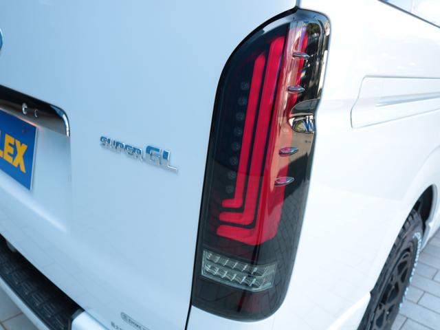 ハイエースバン スーパーＧＬ　ダークプライムＩＩ　登録済み未使用車　アルパイン１１インチフローティングナビ　ＨＤＭＩポート　ティーフォーススポイラー　ネクサストレイルＡＷ　オープンカントリーＲＴ　アルティメットＩＩテールランプ　パノラミックビュー（29枚目）