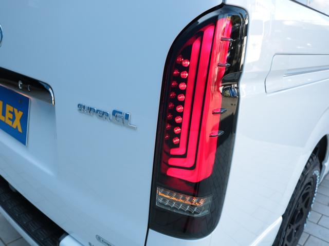 ハイエースバン スーパーＧＬ　ダークプライムＩＩ　登録済み未使用車　アルパイン１１インチフローティングナビ　ＨＤＭＩポート　ティーフォーススポイラー　ネクサストレイルＡＷ　オープンカントリーＲＴ　アルティメットＩＩテールランプ　パノラミックビュー（31枚目）