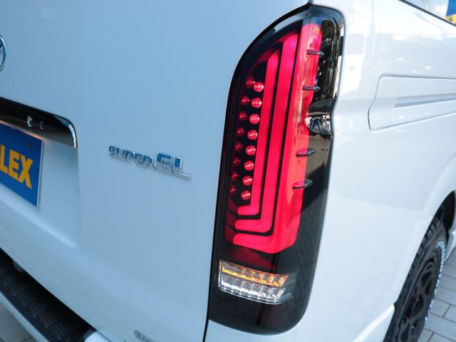 ハイエースバン スーパーＧＬ　ダークプライムＩＩ　登録済み未使用車　アルパイン１１インチフローティングナビ　ＨＤＭＩポート　ティーフォーススポイラー　ネクサストレイルＡＷ　オープンカントリーＲＴ　アルティメットＩＩテールランプ　パノラミックビュー（32枚目）