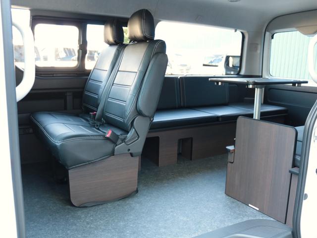 ハイエースワゴン GL ロング シートアレンジvariousヴァリアス 8ナンバーキャンピング 二の字レイアウト フローリング テーブル 前後アルパイン大画面モニター スポイラー デルフ06AW オバフェン LEDテール ローダウン(33枚目)
