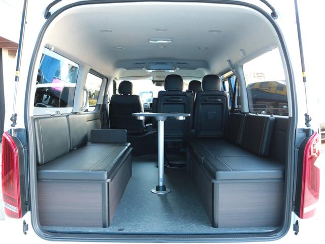 ハイエースワゴン GL ロング シートアレンジvariousヴァリアス 8ナンバーキャンピング 二の字レイアウト フローリング テーブル 前後アルパイン大画面モニター スポイラー デルフ06AW オバフェン LEDテール ローダウン(34枚目)