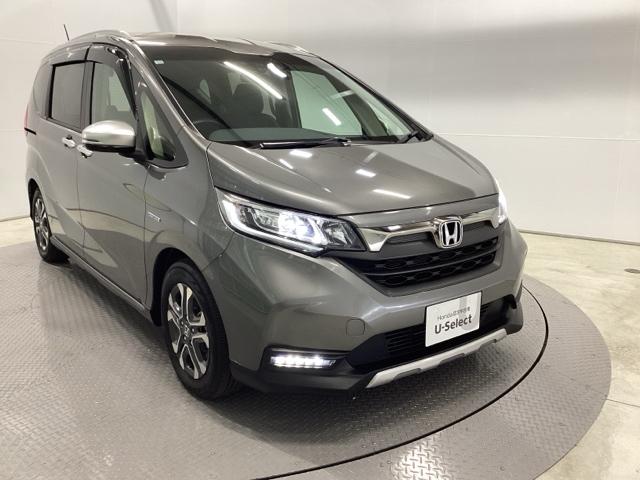 フリード+ハイブリッド ハイブリッド・クロスターホンダセンシング 両側電動スライドドア クルコン バックカメラ 純正ナビ フルセグ ETC シートヒーター 両側電動ドア サイドエアバッグ LEDヘッドライト スマートキー 横滑り防止装置 クルーズコントロール USB(7枚目)