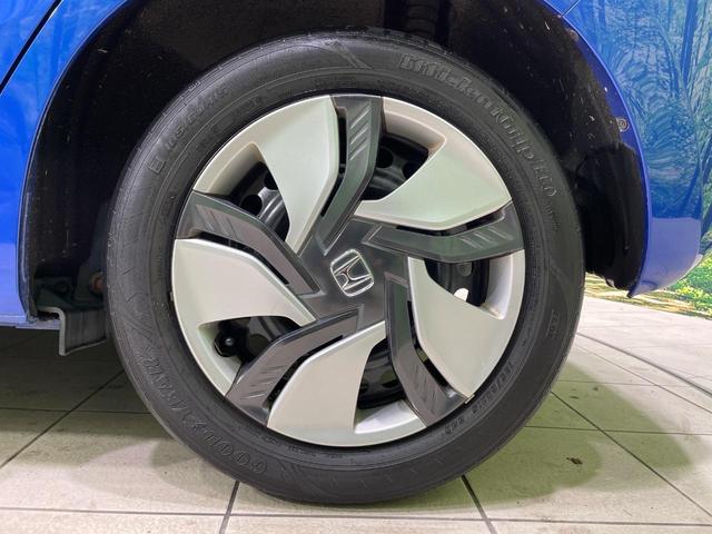 フィットハイブリッド Ｆパッケージ　メーカーナビ　バックカメラ　衝突軽減装置　禁煙車　スマートキー　ＬＥＤヘッド　ＥＴＣ　オートライト　オートエアコン　Ｂｌｕｅｔｏｏｔｈ　ＣＤ　ＤＶＤ再生　フルセグ　ステアリングスイッチ　電動格納ミラー（30枚目）