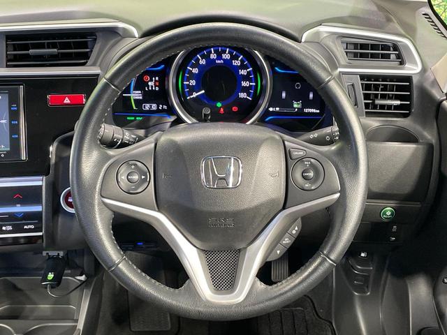 フィットハイブリッド Ｌパッケージ　純正ナビ　バックカメラ　衝突軽減装置　禁煙車　ハーフレザーシート　ドラレコ　スマートキー　ＬＥＤヘッド　ＥＴＣ　クルコン　オートライト　オートエアコン　Ｂｌｕｅｔｏｏｔｈ　ＣＤ　ＤＶＤ再生（11枚目）