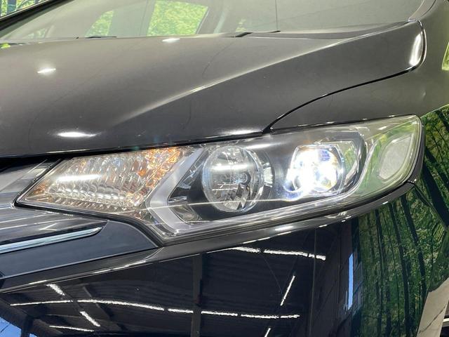 フィットハイブリッド Ｌパッケージ　純正ナビ　バックカメラ　衝突軽減装置　禁煙車　ハーフレザーシート　ドラレコ　スマートキー　ＬＥＤヘッド　ＥＴＣ　クルコン　オートライト　オートエアコン　Ｂｌｕｅｔｏｏｔｈ　ＣＤ　ＤＶＤ再生（12枚目）