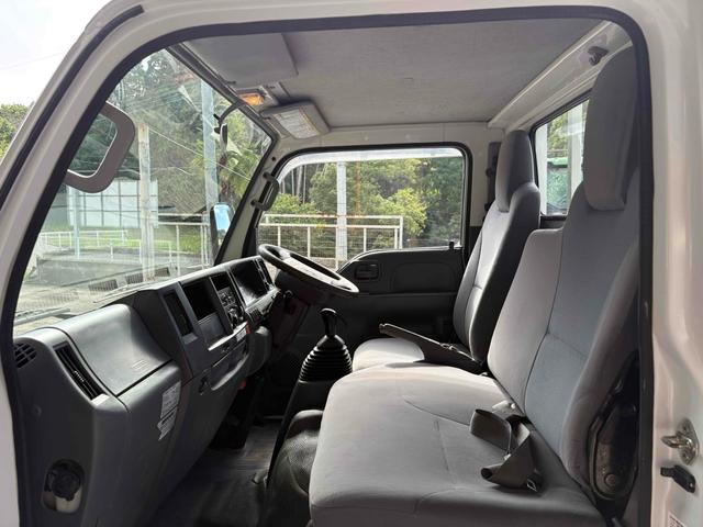 エルフトラック フラットロー 3トン4WDトラック 全塗装 荷台鉄板張り、4方ドア板交換済 三方開 MT 後輪ダブル パワステ アイドリングストップ 電動格納ミラー ABS エアコン パワーウィンドウ(21枚目)