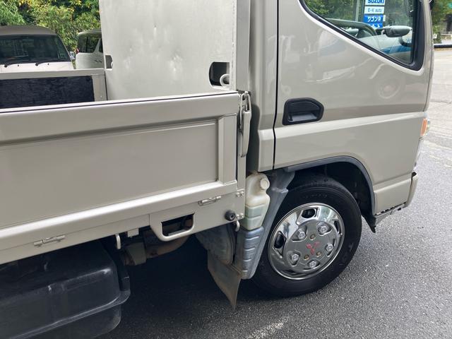 キャンター 2t 低床 荷台床鉄板張り 3方開 電動格納ミラー 5速マニュアル 4900ディーゼルターボ 純正色全塗装済み リヤWタイヤ ABS エアバッグ(29枚目)