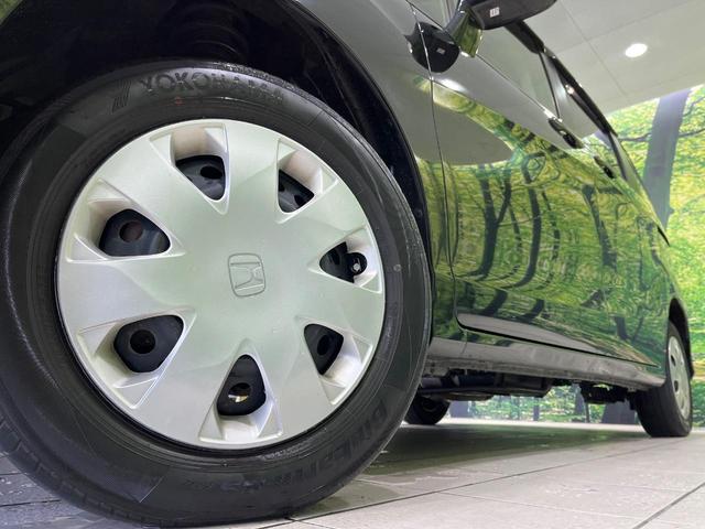 フリード Ｇ　プレミアムエディション　４ＷＤ　純正９型ナビ　後席モニター　両側パワースライドドア　バックカメラ　クルーズコントロール　ＥＴＣ　ＣＤ／ＤＶＤ／フルセグ　ＨＩＤランプ　フロントフォグ　オートライト　オートエアコン　スマートキー（14枚目）