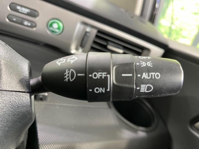 フリード Ｇ　プレミアムエディション　４ＷＤ　純正９型ナビ　後席モニター　両側パワースライドドア　バックカメラ　クルーズコントロール　ＥＴＣ　ＣＤ／ＤＶＤ／フルセグ　ＨＩＤランプ　フロントフォグ　オートライト　オートエアコン　スマートキー（32枚目）