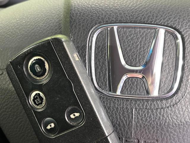 フリード Ｇ　プレミアムエディション　４ＷＤ　純正９型ナビ　後席モニター　両側パワースライドドア　バックカメラ　クルーズコントロール　ＥＴＣ　ＣＤ／ＤＶＤ／フルセグ　ＨＩＤランプ　フロントフォグ　オートライト　オートエアコン　スマートキー（34枚目）