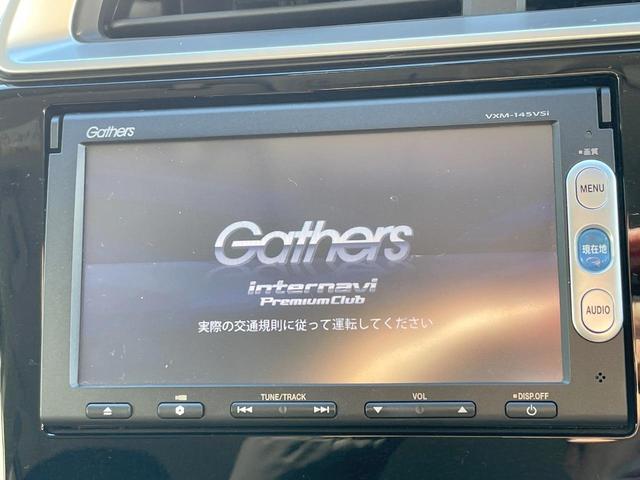 フィットハイブリッド Fパッケージ 禁煙車 純正ナビ スマートキー ETC オートエアコン Bluetooth 横滑り防止装置 電動格納ミラー CD・DVD再生(3枚目)