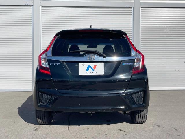 フィットハイブリッド Fパッケージ 禁煙車 純正ナビ スマートキー ETC オートエアコン Bluetooth 横滑り防止装置 電動格納ミラー CD・DVD再生(15枚目)