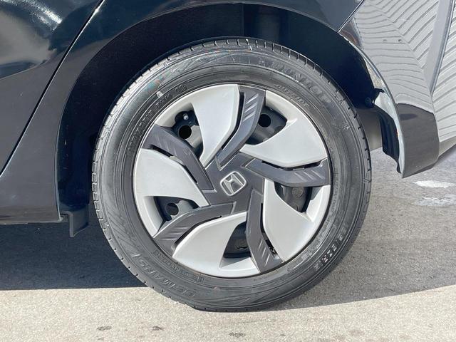 フィットハイブリッド Fパッケージ 禁煙車 純正ナビ スマートキー ETC オートエアコン Bluetooth 横滑り防止装置 電動格納ミラー CD・DVD再生(50枚目)