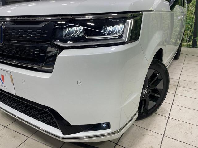 ステップワゴン ｅ：ＨＥＶスパーダ　両側電動ドア　純正１１型ナビ　バックカメラ　衝突被害軽減システム　Ｂｌｕｅｔｏｏｔｈ接続　レーダークルーズ　電動リアゲート　ハーフレザーシート　コーナーセンサー　スマートキー　ＬＥＤヘッド（14枚目）