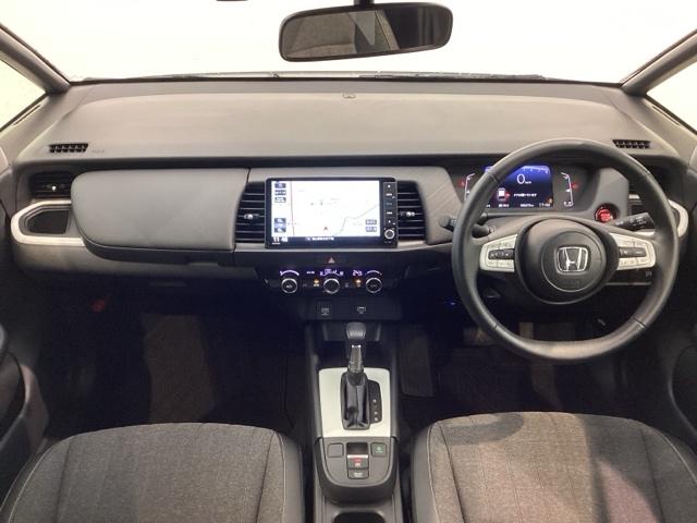 フィット ホーム H SENSING 新車保証 試乗車 ワンオ-ナ- ナビVXU-245FTi TV Rカメラ CD録音 BTオ-ディオ DVD ドラレコ ETC LEDライト VSA クルコン スマ-トキ- AAC(9枚目)