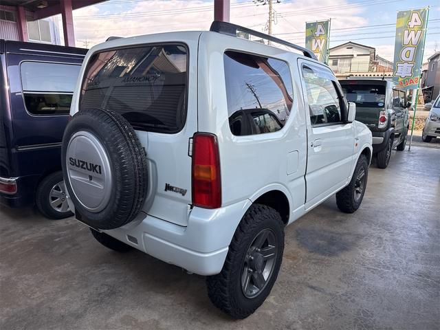 ジムニー ワイルドウインド 4WD ETC ナビ TV キーレスエントリー 電動格納ミラー シートヒーター AT ABS ルーフレール アルミホイール 衝突安全ボディ エアコン パワーウィンドウ(17枚目)