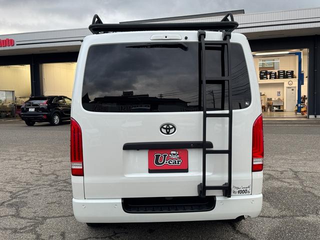 ハイエースバン スーパーGL ダークプライムII 4WD ディーゼル リフトアップ 両側パワースリアドドア バンパーガードオーバーフェンダー チッピング塗装 ベットキット デジタルインナーミラー 全方位モニター プッシュスタート LEDヘッドライト(7枚目)