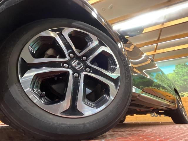 ヴェゼル ハイブリッドＺ・ホンダセンシング　４ＷＤ　純正ナビ　バックカメラ　寒冷地仕様　ホンダセンシング　レーダークルーズ　禁煙車　ハーフレザーシート　シートヒーター　コーナーセンサー　ＬＥＤヘッド　ビルトインＥＴＣ　純正１７インチアルミ（13枚目）