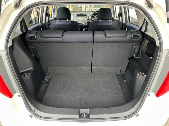 フィット G【タイミングチェーン】【2023年製ダンロップタイヤ】禁煙 【純正HDDナビ/ワンセグ/CD&DVD再生/バックカメラ】【ETC】【キーレス】【電格ミラー】【ミラーウインカー】【スペアキー有】(26枚目)