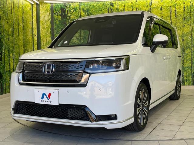 ステップワゴン ｅ：ＨＥＶスパーダ　プレミアムライン　ホンダセンシング　両側パワースライドドア　純正１１．４インチ純正ナビ　全周囲カメラ　Ｂｌｕｅｔｏｏｔｈ再生　ドライブレコーダー　ＥＴＣ　デュアルオートエアコン　クリアランスソナー　禁煙車　ＬＥＤヘッド（57枚目）