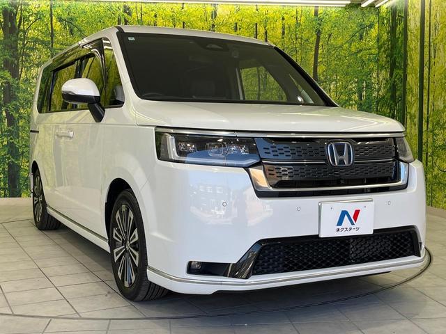 ステップワゴン ｅ：ＨＥＶスパーダ　プレミアムライン　ホンダセンシング　両側パワースライドドア　純正１１．４インチ純正ナビ　全周囲カメラ　Ｂｌｕｅｔｏｏｔｈ再生　ドライブレコーダー　ＥＴＣ　デュアルオートエアコン　クリアランスソナー　禁煙車　ＬＥＤヘッド（63枚目）
