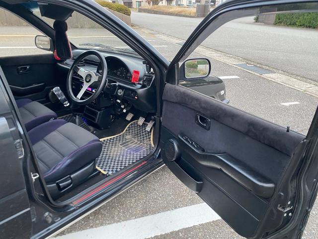 ミラ Ｊ－タイプＱ　５速マニュアル　社外ショック＆スプリング　ワンオフマフラー　アヴァンツアート内装換装　フェンダートリム　社外アルミ　Ｂｌｕｅｔｏｏｔｈ対応オーディオ　車検整備付（27枚目）