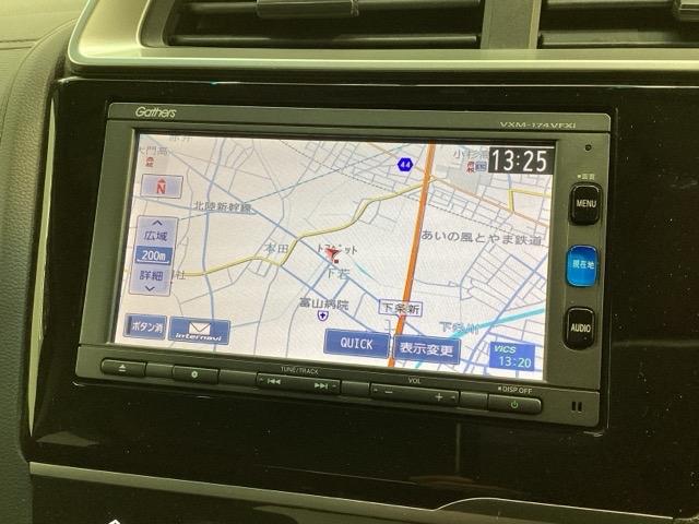 フィットハイブリッド Ｆ　１年保証　ワンオ－ナ－　ナビＶＸＭ－１７４ＶＦＸｉ　ＴＶ　Ｒカメラ　ＢＴオ－ディオ　ＤＶＤ　ＥＴＣ　ＬＥＤライト　ＶＳＡ　スマ－トキ－　盗難防止装置　整備記録簿　ＡＡＣ　ドアバイザ－　Ｗエアバッグ（3枚目）