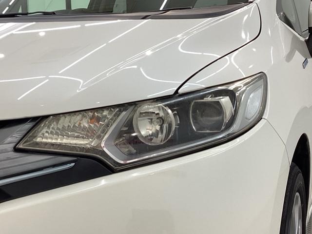 フィットハイブリッド Ｌパッケージ　１年保証ナビフルセグＲカメラＤＶＤ　記録簿　イモビライザー　キーフリー　ＰＳ　ＬＥＤ　ナビＴＶ　ＥＴＣ車載器　地デジ　ＰＷ　クルコン　スマートキーシステム　エアコン　エアバッグ　ＡＢＳ　ＡＷＤ（5枚目）