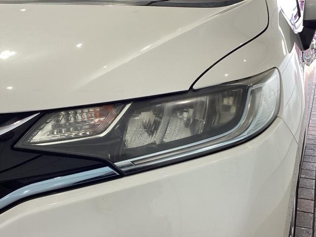 フィットハイブリッド Ｌホンダセンシング　１年保証　ナビ　ＶＸＭ－１７４ＶＦｉ　ＴＶ　Ｒカメラ　ＣＤ録音　ＢＴオ－ディオ　ＤＶＤ　ＥＴＣ　ＬＥＤライト　ＶＳＡ　クルコン　アルミ　スマ－トキ－　盗難防止装置　整備記録簿　ＡＡＣ　スペアキ－　禁煙（8枚目）