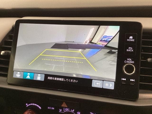 フィット ｅ：ＨＥＶＲＳ　Ｈ　ＳＥＮＳＩＮＧ　最長５年保証　ワンオ－ナ－　純正ナビ　ＴＶ　Ｒカメラ　ＢＴオ－ディオ　ＥＴＣ　ＬＥＤライト　ＶＳＡ　クルコン　アルミ　スマ－トキ－　盗難防止装置　整備記録簿　ＡＡＣ　スペアキ－（7枚目）