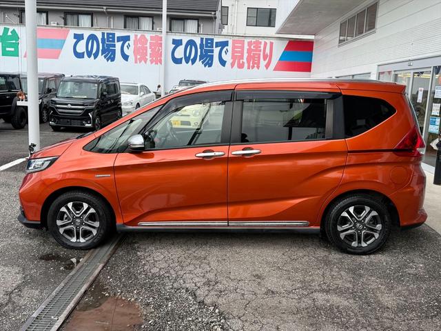 フリード+ハイブリッド ハイブリッド・クロスターホンダセンシングアダプティブクルコン ホンダセンシング CMBS アダプティブクルコン LKA 9型ナビTV Bカメラ ブルートゥース DVD再生 CD録音 両側パワスラ アップルカープレイ ハーフレザーシート ビルトインETC 試乗OK(4枚目)