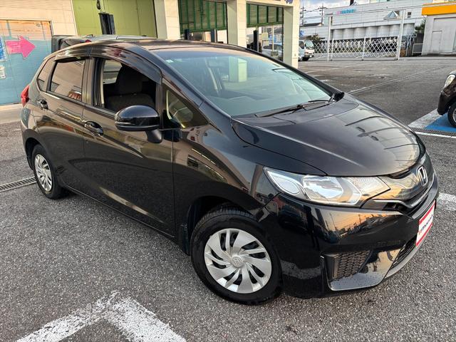 フィット 13G・Fパッケージ 純正ナビTV スマートキー 試乗OK 純正インターナビ 地デジTV ブルートゥース DVD再生 スマートキー プッシュスタート ETC アイドリングストップ 電格ミラー VSA ECON オートエアコン ヘッドライトレベライザー 試乗OK(5枚目)