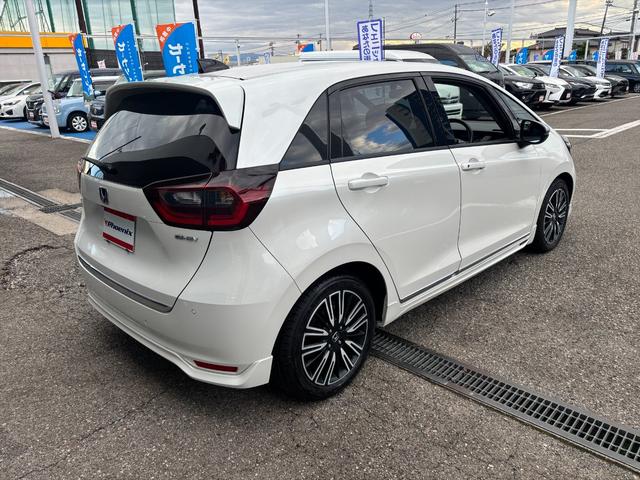 フィット e:HEVリュクス モデューロフルエアロ ホンダセンシング ModuloエアロFSR ホンダセンシング アダプティブクルーコントロール 純正9インチナビ フルセグ バックカメラ Bluetooth ビルトインETC 前後ドラレコ シートヒーター 試乗OK(7枚目)