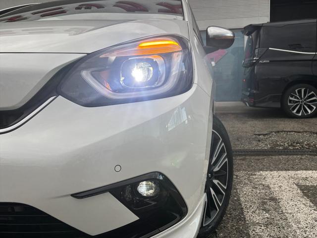 フィット e:HEVリュクス モデューロフルエアロ ホンダセンシング ModuloエアロFSR ホンダセンシング アダプティブクルーコントロール 純正9インチナビ フルセグ バックカメラ Bluetooth ビルトインETC 前後ドラレコ シートヒーター 試乗OK(12枚目)