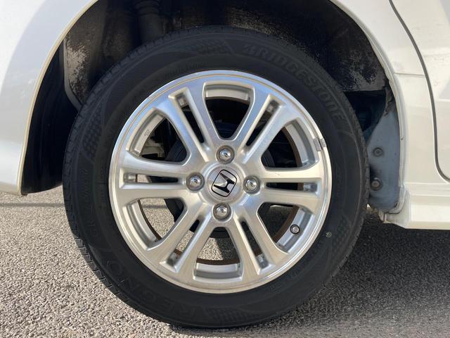 N-BOXカスタム G・Lパッケージ 電動スライドドア 純正SDナビ バックカメラ 禁煙車 スマートキー HIDヘッド ETC オートライト オートエアコン 純正14インチアルミ CD DVD再生 地デジ(25枚目)