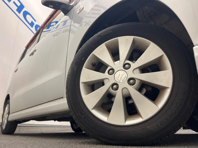 ワゴンＲ ＦＸリミテッド　禁煙車　スマートキー　純正１４インチアルミホイール　オーディオ　プライバシーガラス　ドアバイザー（11枚目）