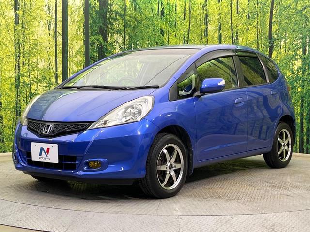フィット Gスマートセレクション 4WD 楽ナビ バックカメラ 寒冷地仕様 禁煙車 スマートキー HIDヘッド ビルトインETC オートライト CD/DVD再生 シートリフター 電動格納ミラー 15インチAW プライバシーガラス(27枚目)